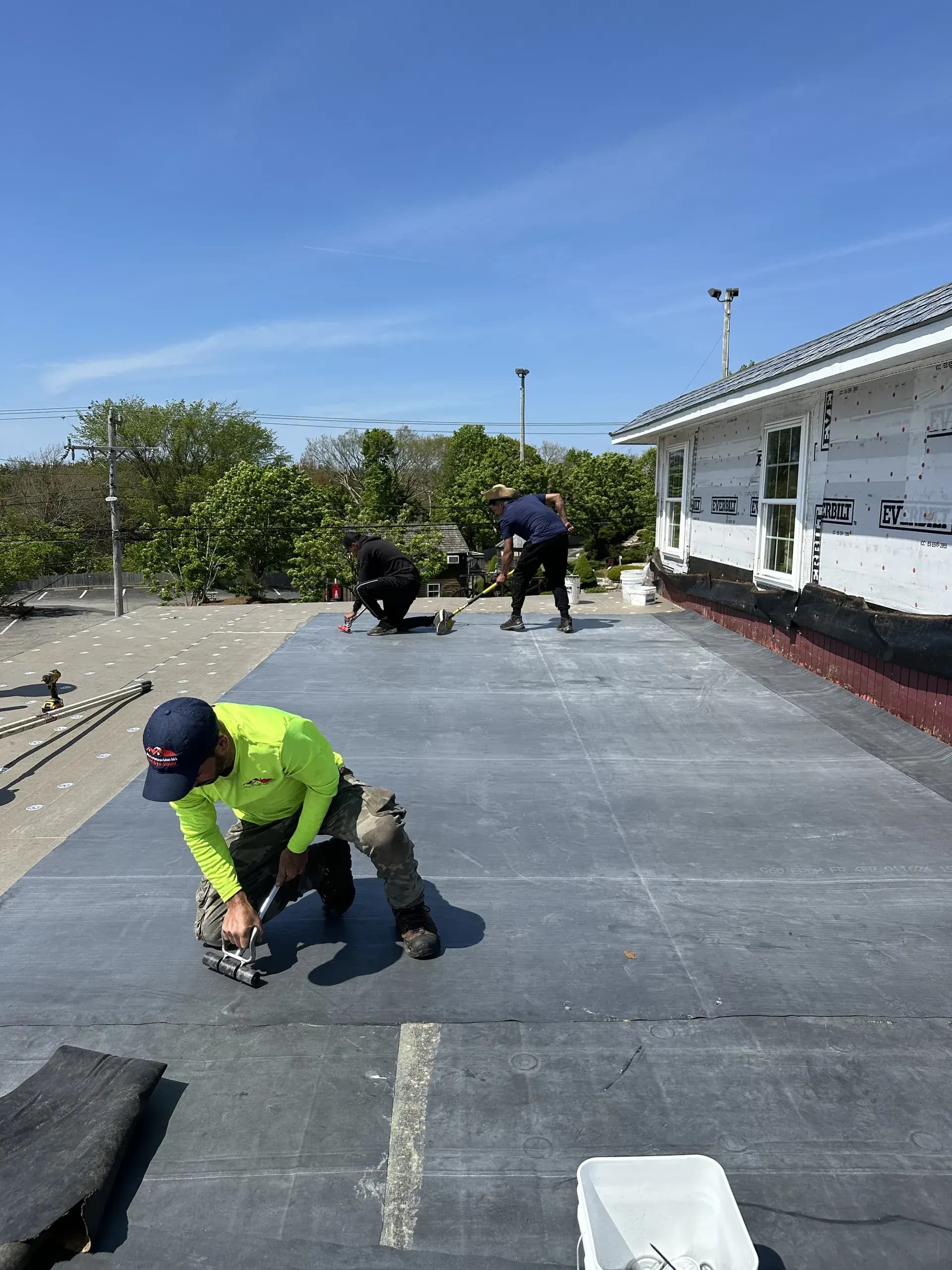 JPA Construction team installing exterior vinyl siding on Cape Cod home